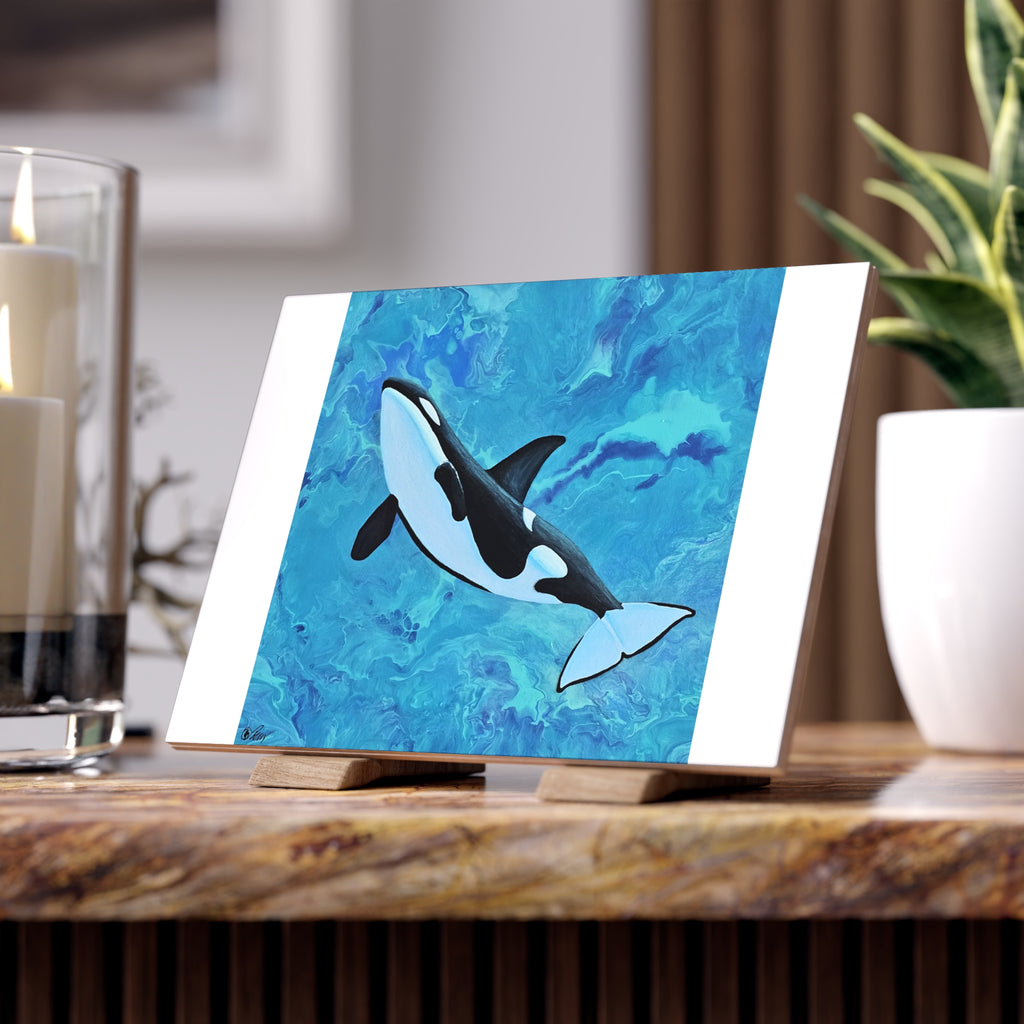 Orca whale painting on a stand with a blurred background tile