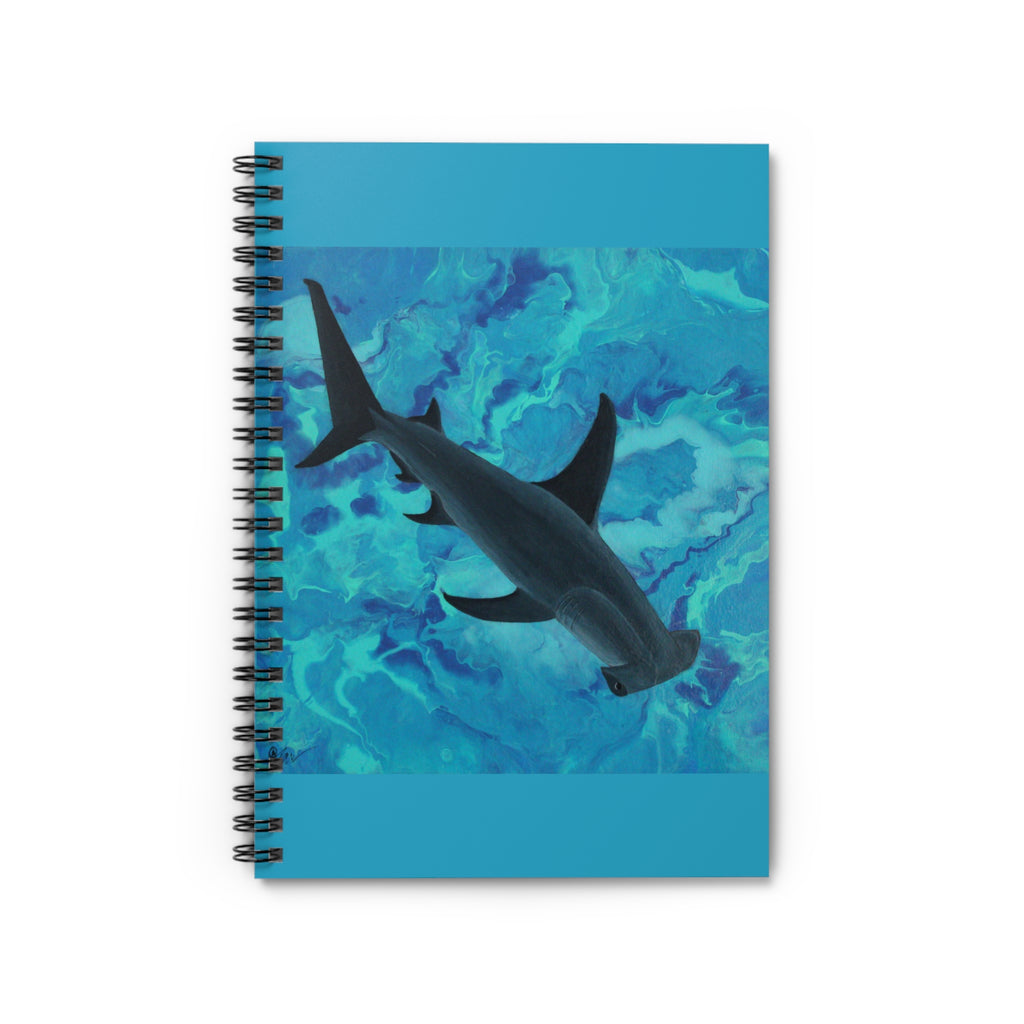 Notebook with a shark design on a blue watercolor background