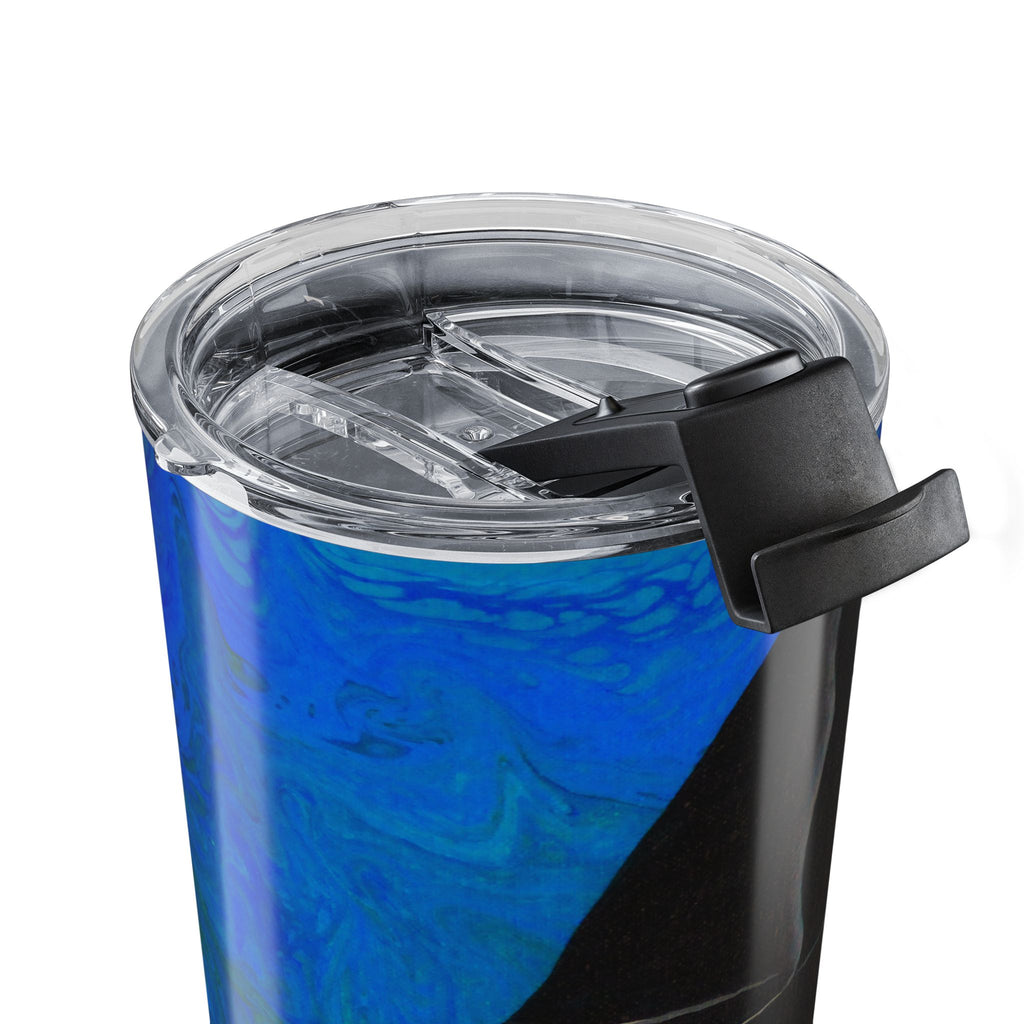 Blue tumbler with a clear lid and black handle on a white background