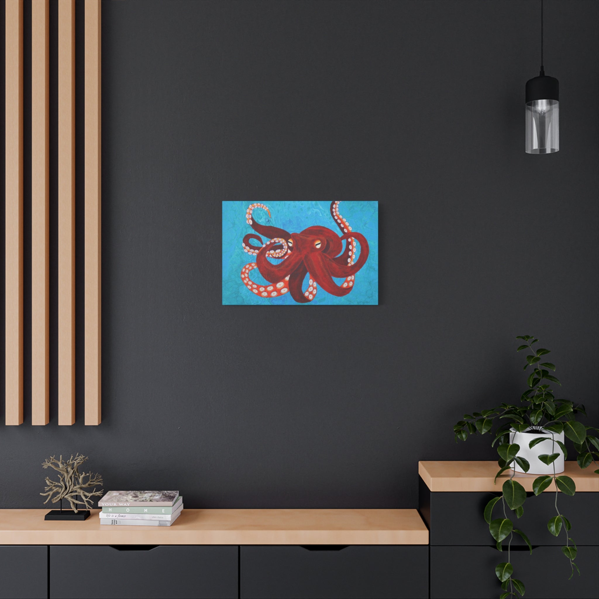 Red octopus artwork on a blue background in a modern interior setting.