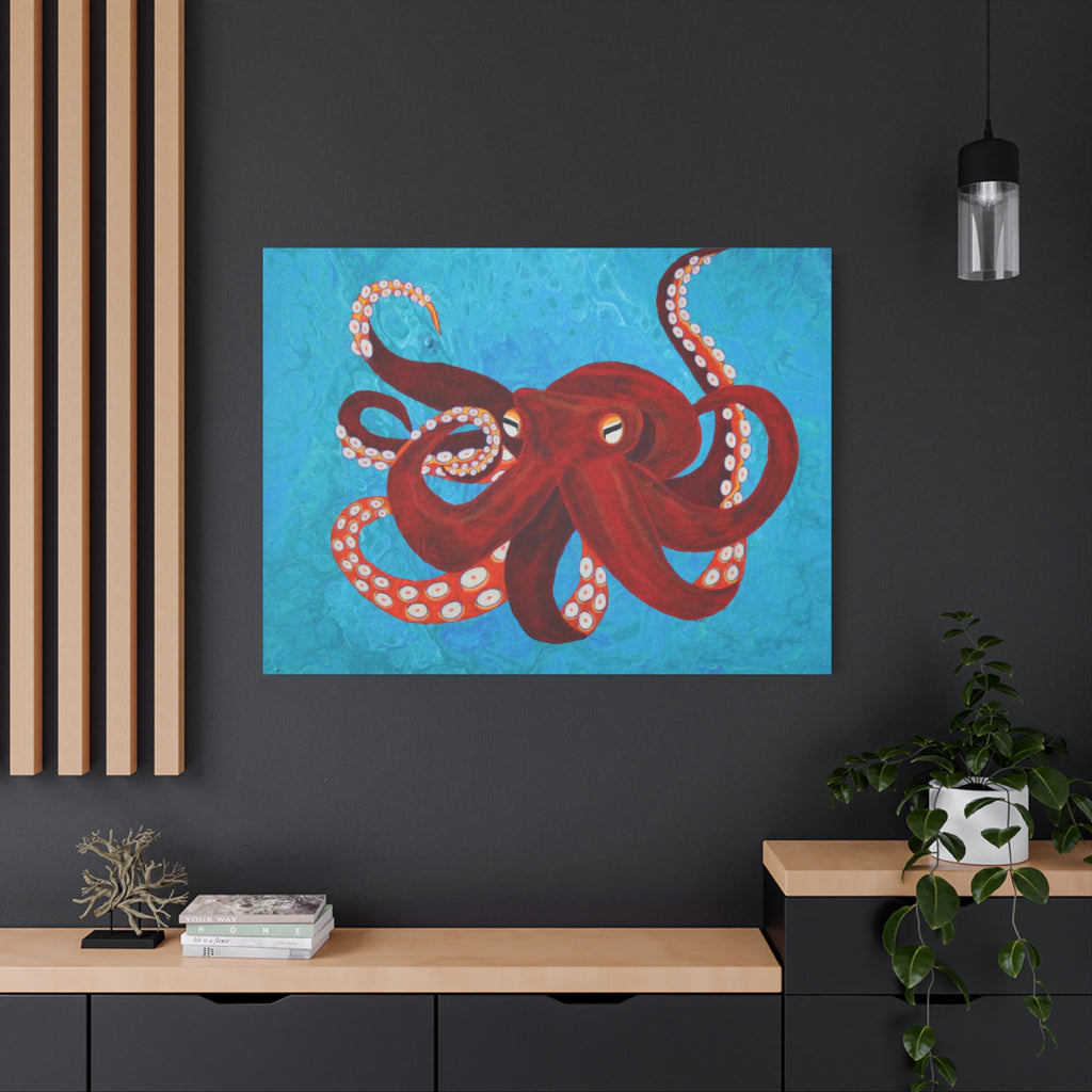 Framed artwork of a red octopus on a blue background in a modern interior setting.