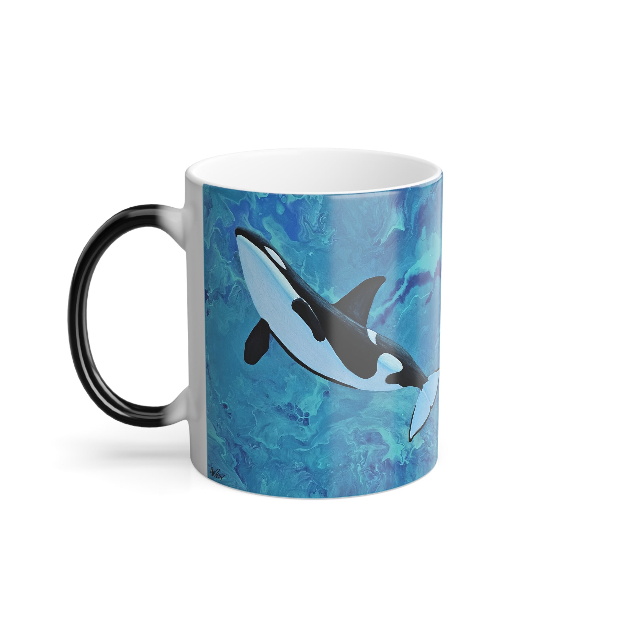 Mug with an orca whale design on a blue watercolor background