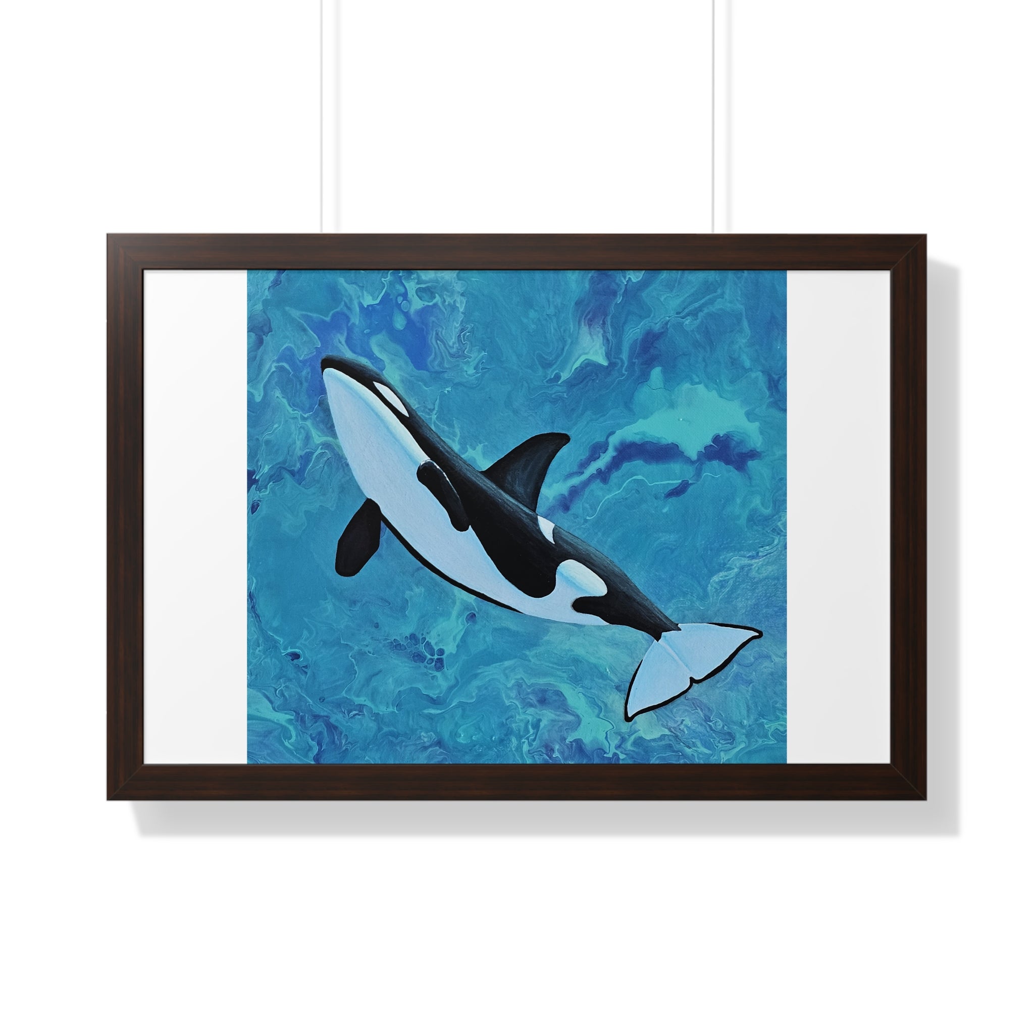 Framed artwork of an orca whale on a blue abstract background