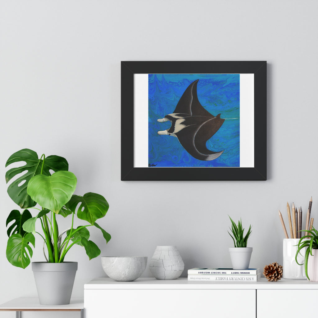 Framed artwork of a manta ray on a wall above a white cabinet with decorative items.