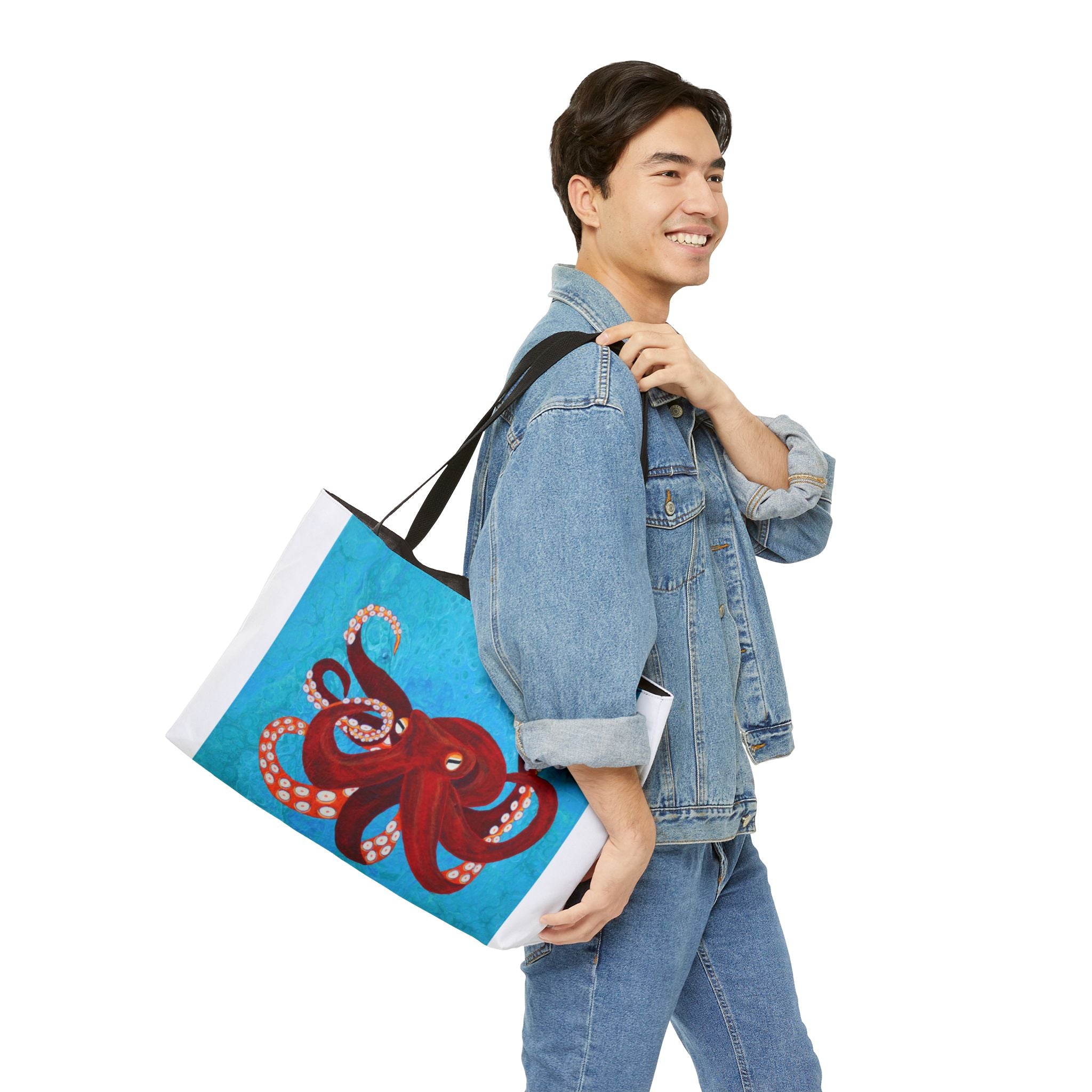 Man carrying a tote bag with an octopus design on a white background