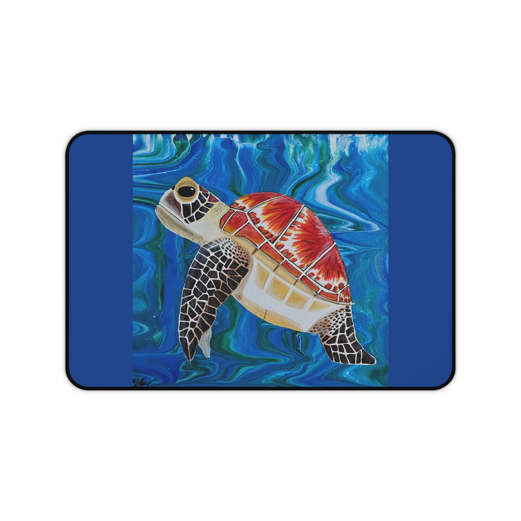 Desk pad with a turtle design on a blue water background