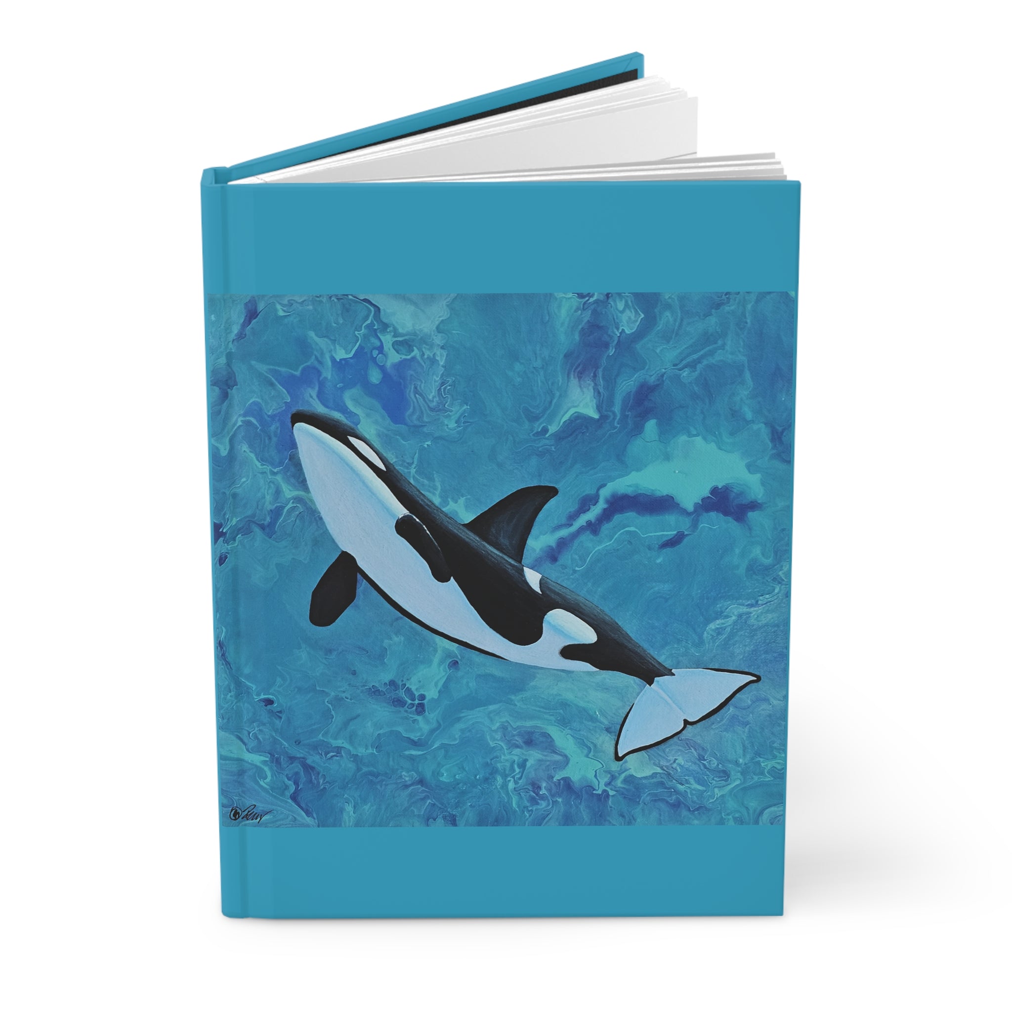 Notebook with an orca whale design on a blue abstract patterned cover