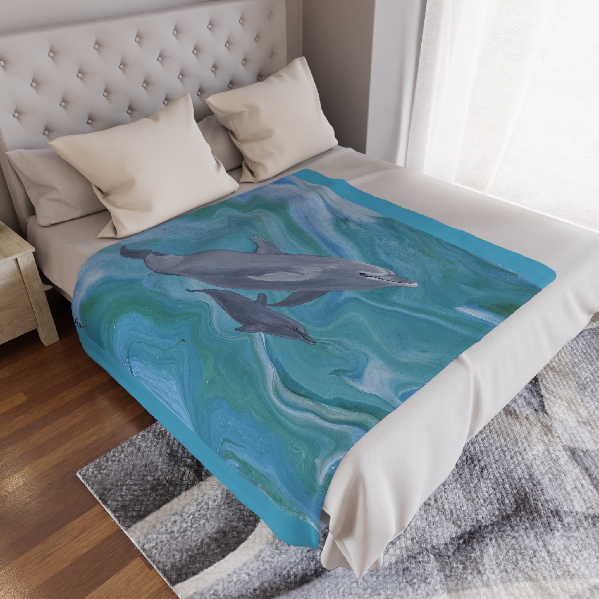 Bed with a blanket featuring dolphins in a bedroom setting